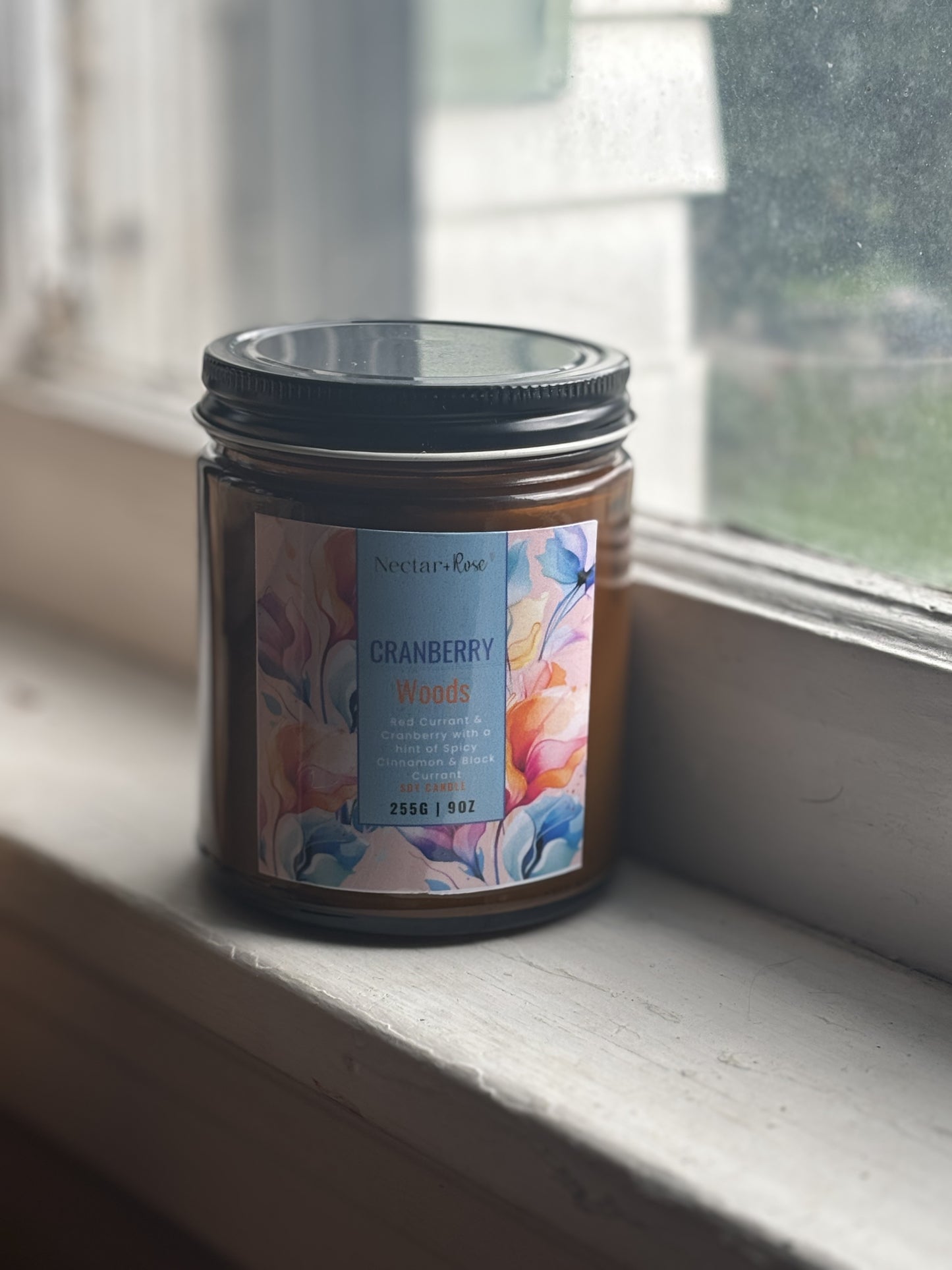 Nectar & RoseCranberry WoodsIndulge in the warm and inviting aroma of Cranberry Woods. This 100% soy candle features notes of red currant and cranberry, enhanced by a touch of spicy cinnamon. ECranberry Woods